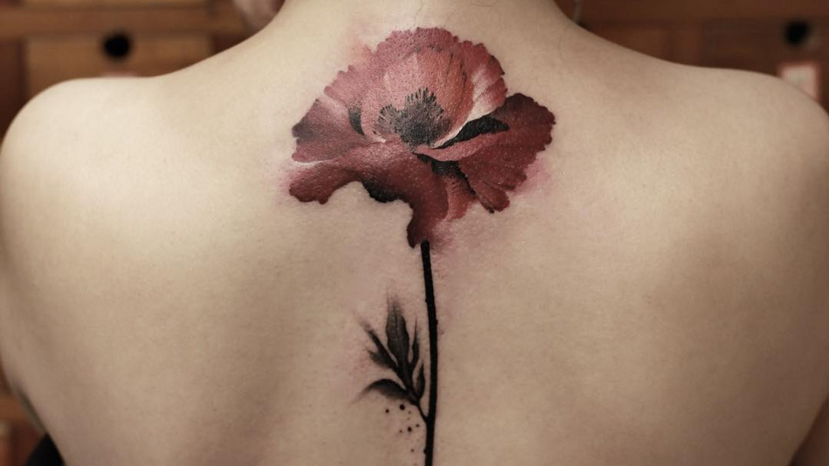 Чарівні ідеї татуювань на спині: яскраві фото - фото 1