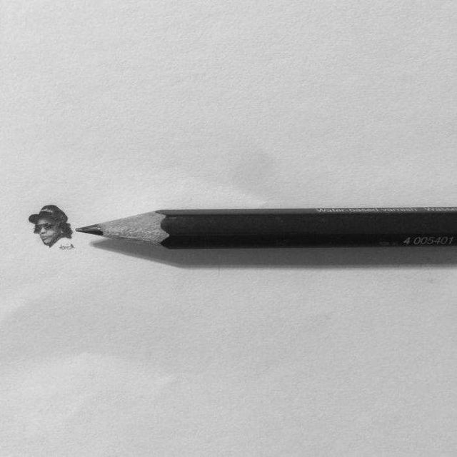 Американець створює мініатюрні малюнки з безліччю деталей - фото 299081