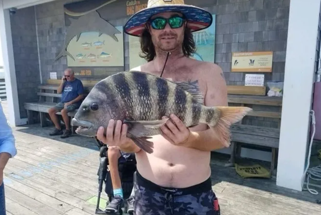 Рибалка у США упіймав унікальну рибу з 'людськими' зубами: фотофакт - фото 471473